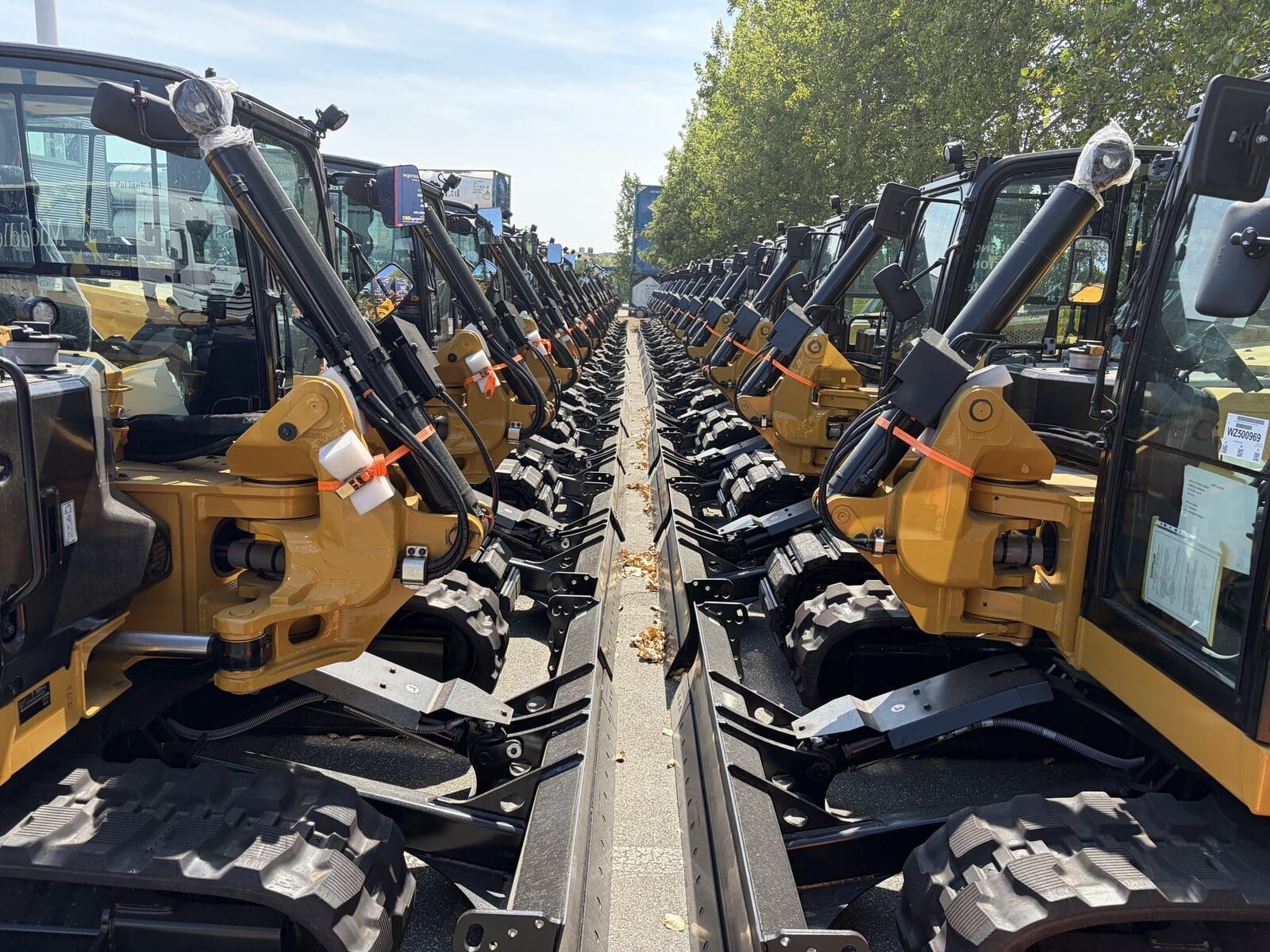 Rows of mini excavators devanned from containers and stored at Middlegate Europe before dealer distribution across Europe